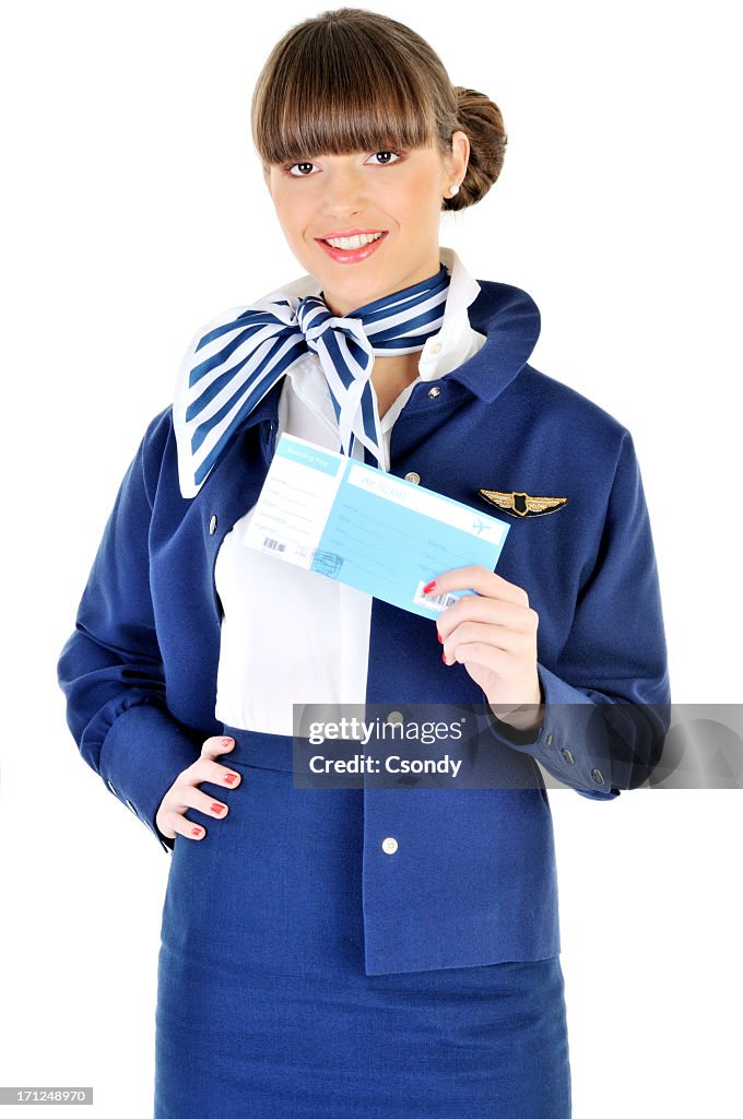 Young beautiful flight attendant holding ticket