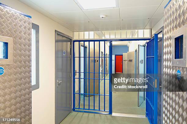 inside of a modern prison with open doors - releasing stock pictures, royalty-free photos & images