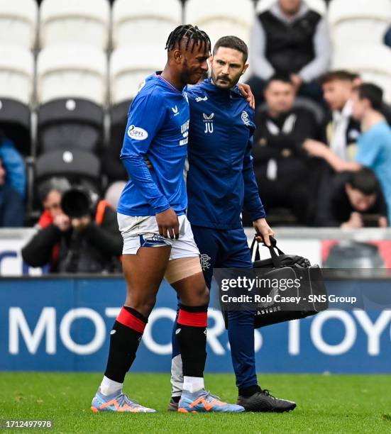 Rangers' Zak Lovelace is helped off the pitch after injuring his hamstring during a cinch Premiership match between St Mirren and Rangers at the...