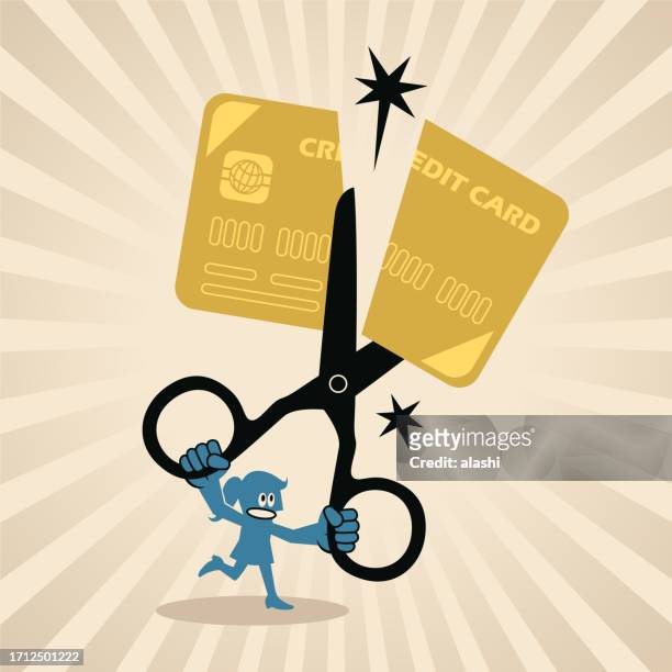 a businesswoman cutting off a credit card with scissors - wasting money stock illustrations