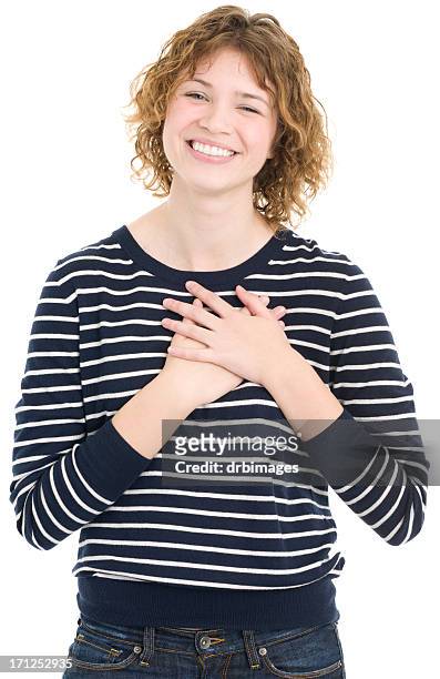 happy young woman with hands on chest - hand on heart stock pictures, royalty-free photos & images