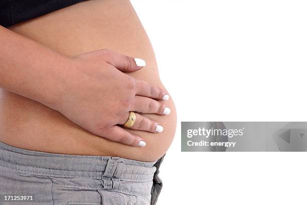 woman with hand on belly - svullen bildbanksfoton och bilder