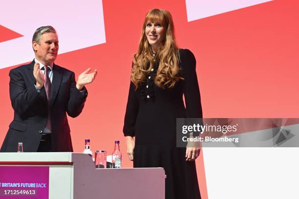 Keir Starmer, leader of the Labour Party, left, applauds Angela Rayner, deputy leader of the Labour Party, following her speech on the opening day of...