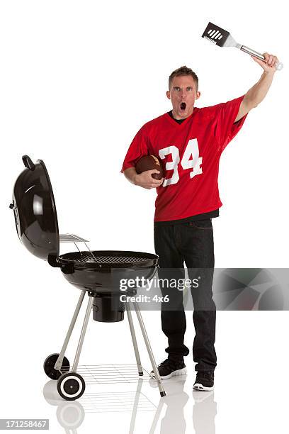 sportsman barbecuing food and shouting - spatula stock pictures, royalty-free photos & images