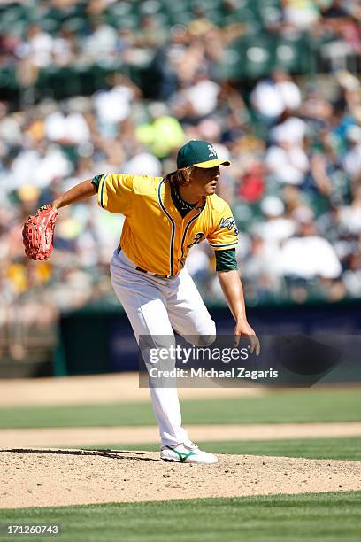 Hideki Okajima of the Oakland Athletics pitches during the game against the New York Yankees at O.co Coliseum on June 13, 2013 in Oakland,...