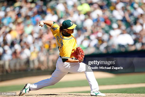 Hideki Okajima of the Oakland Athletics pitches during the game against the New York Yankees at O.co Coliseum on June 13, 2013 in Oakland,...