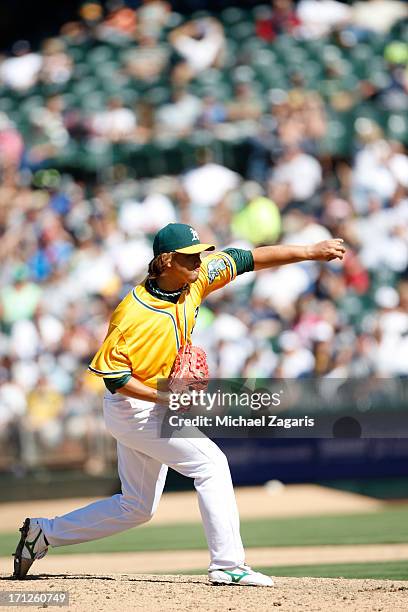 Hideki Okajima of the Oakland Athletics pitches during the game against the New York Yankees at O.co Coliseum on June 13, 2013 in Oakland,...