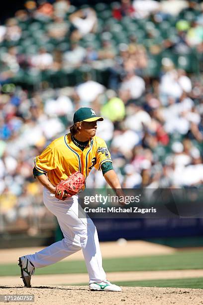 Hideki Okajima of the Oakland Athletics pitches during the game against the New York Yankees at O.co Coliseum on June 13, 2013 in Oakland,...