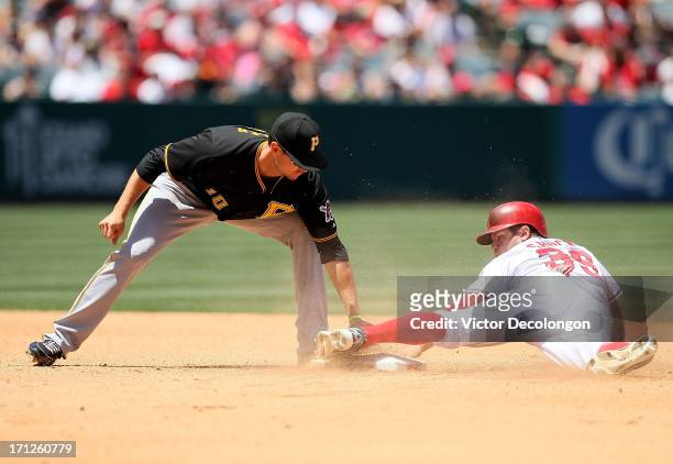 Shuck of the Los Angeles Angels of Anaheim steals second base in the fourth inning as Jody Mercer of the Pittsburgh Pirates is late with the tag...