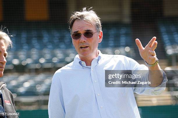 General Manager Billy Beane of Oakland Athletics watching the team first round draft pick Billy McKinney takes batting practice during a workout...