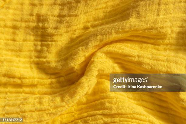 mustard, yellow color woven muslin fabric background texture - gauze stock pictures, royalty-free photos & images