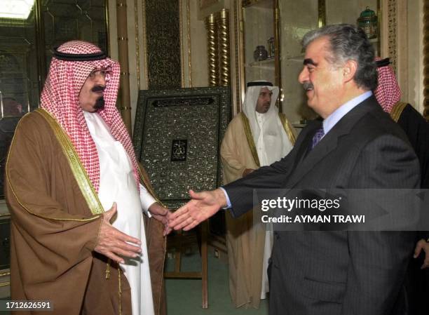 Saudi Crown Prince Abdullah bin Abdul Aziz greets Lebanese Prime Minister Rafiq Hariri upon his arrival in Riyadh 18 November 2000. Hariri is in...