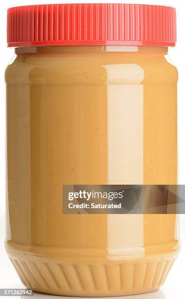 jar of peanut butter on white background - pindakaas stockfoto's en -beelden