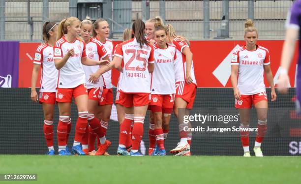 Team members of Bayern celebrate after scoring during the Google Pixel Women's Bundesliga match between SGS Essen and FC Bayern Muenchen at Stadion...