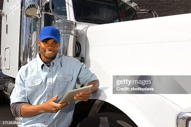 long haul driver and computer - african lorry stock pictures, royalty-free photos & images