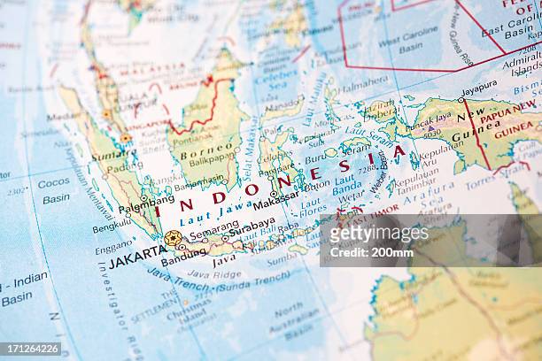 map of indonesia on the world globe - indonesia map stock pictures, royalty-free photos & images
