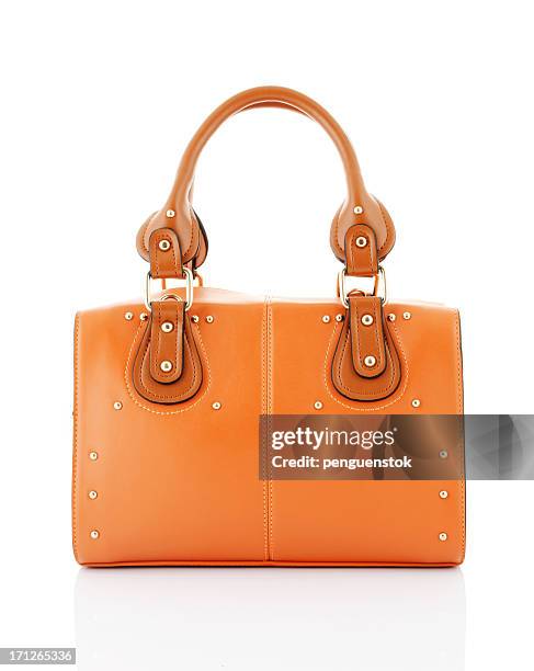 orange handbag - orange purse stock pictures, royalty-free photos & images