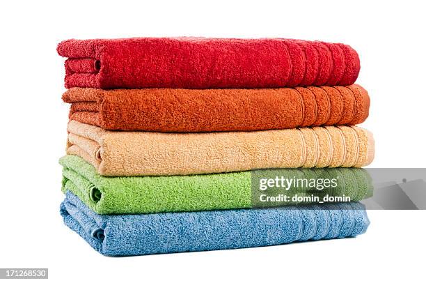 five stacked multicoloured bath towels isolated on white background, studio - handdoek stockfoto's en -beelden