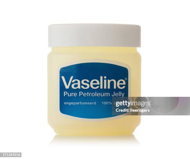 tub of vaseline on a white background - vaseline stock pictures, royalty-free photos & images