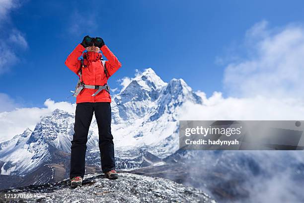 woman looking at ama dablam, mount everest national park - glimpses of daily life in nepal stock pictures, royalty-free photos & images