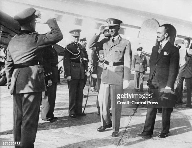 King Leopold III of Belgium is greeted on his arrival as he returns to Brussels from exile in Swizerland where he has spent the last six years, 22nd...