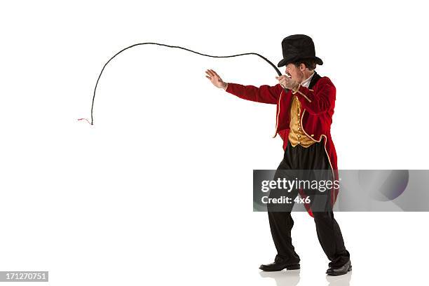 ring master performing with a whip - ringmaster stock pictures, royalty-free photos & images