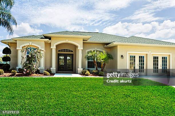 new house with a two car garage sunny beautiful day - large grass area stock pictures, royalty-free photos & images