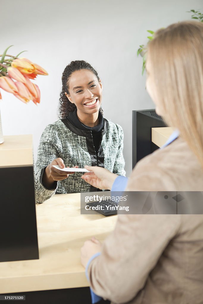 Friendly Teller Helping Customer in Retail Banking Window Counter Vt