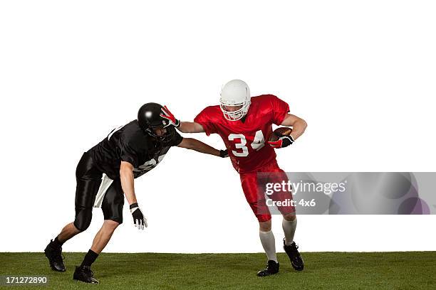 football players in action - american football player isolated stock pictures, royalty-free photos & images
