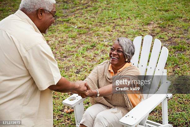senior african american couple - adirondack chair closeup stock pictures, royalty-free photos & images