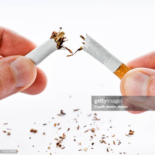 quit smoking, cigarette broken in half, isolated on white - breaking and exiting stock pictures, royalty-free photos & images