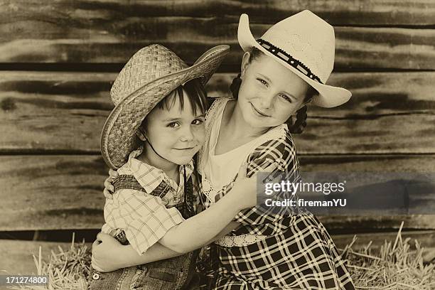 bruder und schwester - cowgirl hairstyles stock-fotos und bilder