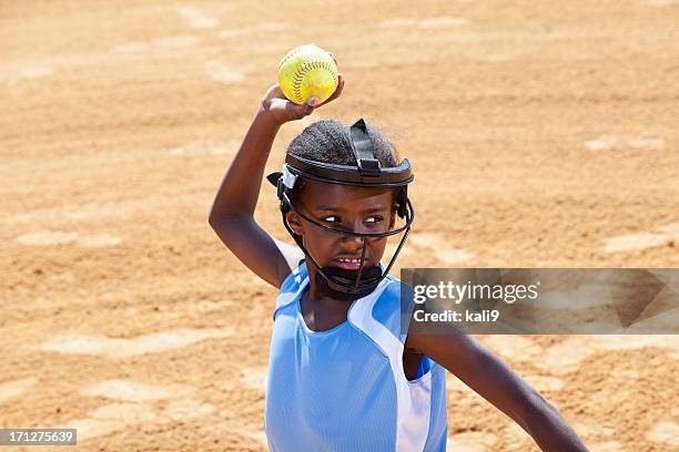 softball player throwing ball - pro baseball pitcher stock pictures, royalty-free photos & images