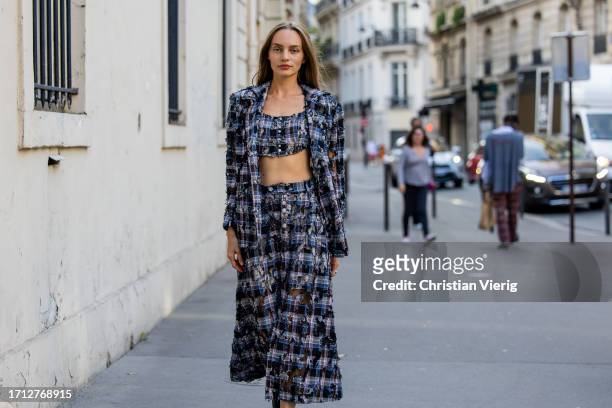 Guest wears checkered cropped top, maxi skirt, blazer outside RDNT Andre Tan during the Womenswear Spring/Summer 2024 as part of Paris Fashion Week...