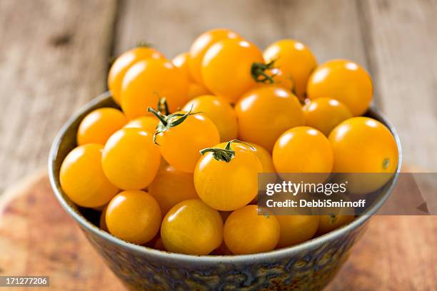 yellow cherry tomatoes - cherry tomato stock pictures, royalty-free photos & images