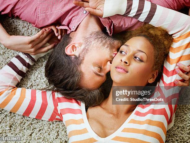 young couple enjoying together - black women kissing white men stock pictures, royalty-free photos & images