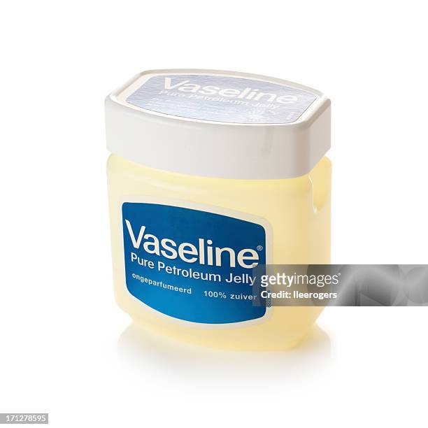 tub of vaseline on a white background - vaseline stock pictures, royalty-free photos & images