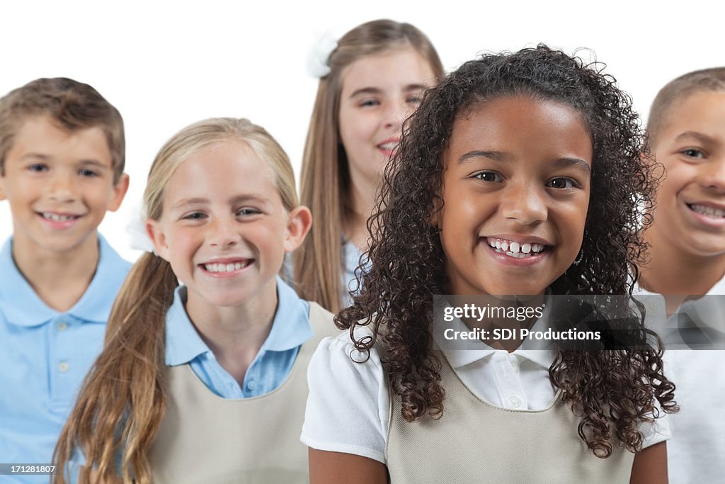 Elementary students in school uniforms, on  white background