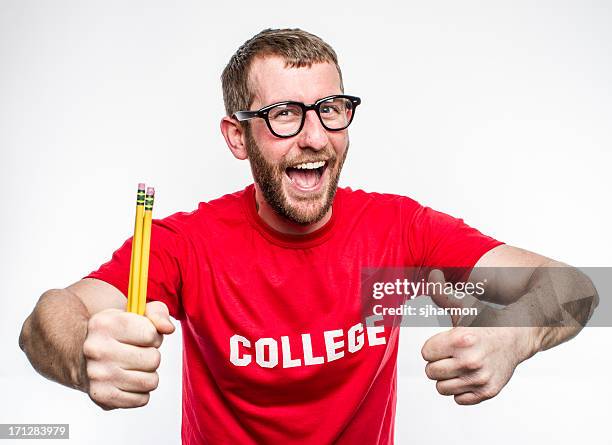 college nerd in red shirt with glasses holding pencils - human nose isolated stock pictures, royalty-free photos & images