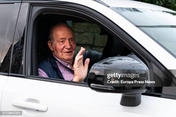 King Juan Carlos waves as he leaves Pedro Campos' house for Vigo airport on October 2 in Sanxenxo, Pontevedra, Galicia, Spain. Juan Carlos I has left...