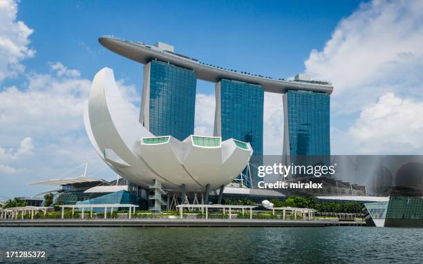 artscience museum and marina bay sands hotel in  singapore - marina bay sands stock pictures, royalty-free photos & images