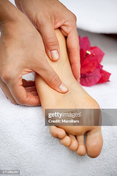 foot massage at the spa - sole of foot bildbanksfoton och bilder