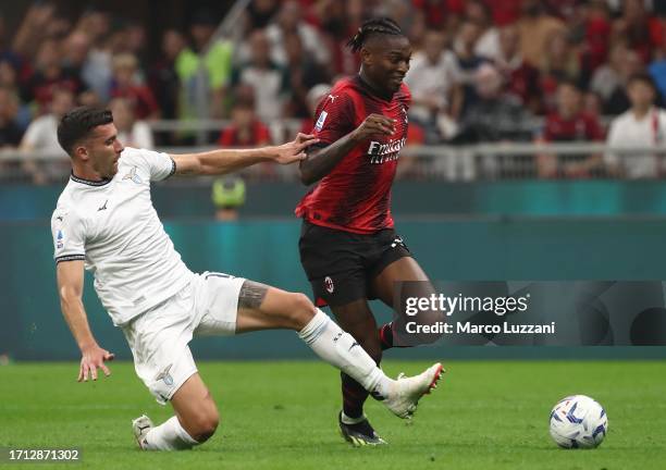 Rafael Leao of AC Milan is tackled by Nicolo’ Casale of SS Lazio during the Serie A TIM match between AC Milan and SS Lazio at Stadio Giuseppe Meazza...