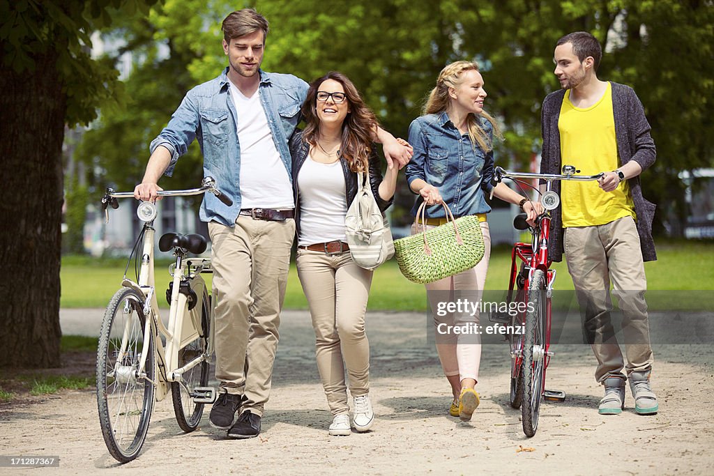 Two Teenage Couples With Bikes
