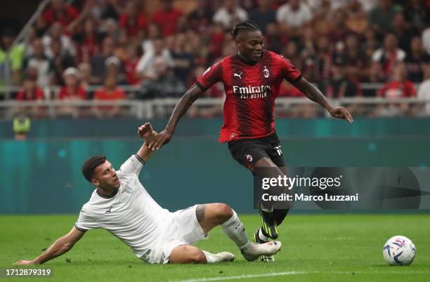 Rafael Leao of AC Milan is tackled by Nicolo’ Casale of SS Lazio during the Serie A TIM match between AC Milan and SS Lazio at Stadio Giuseppe Meazza...