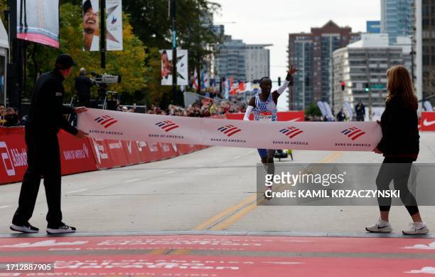 Kenya's Kelvin Kiptum arrives at the finish line line to win the 2023 Bank of America Chicago Marathon in Chicago, Illinois, in a world record time...