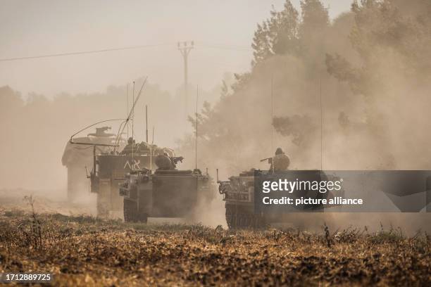 October 2023, Israel, Sderot: Military vehicles are seen after Palestinian militants launched more rockets at Israeli border towns on the second day...