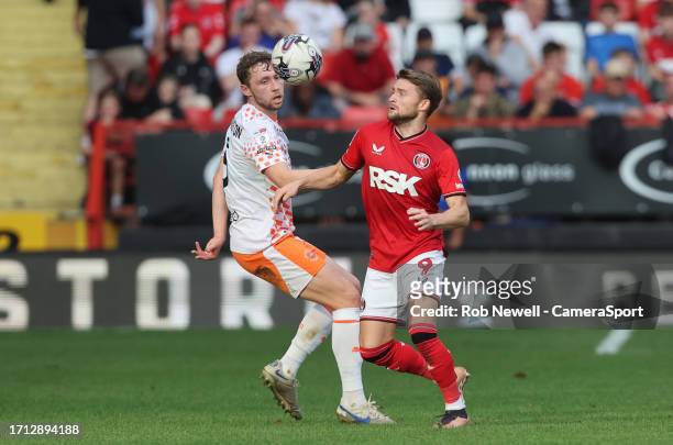 Blackpool's Matthew Pennington and Charlton Athletic's Alfie May during the Sky Bet League One match between Charlton Athletic and Blackpool at...