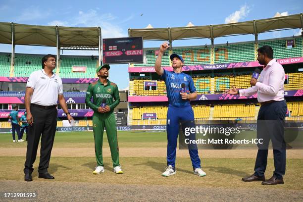 Najmul Hossain Shanto of Bangladesh and Jos Buttler of England during the coss toss before the ICC Men's Cricket World Cup India 2023 warm up match...