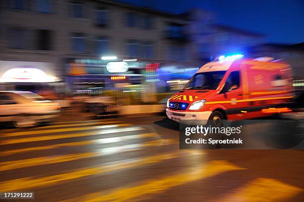 blurred ambulance racing through the streets of marseilles - emergency rescue stock pictures, royalty-free photos & images